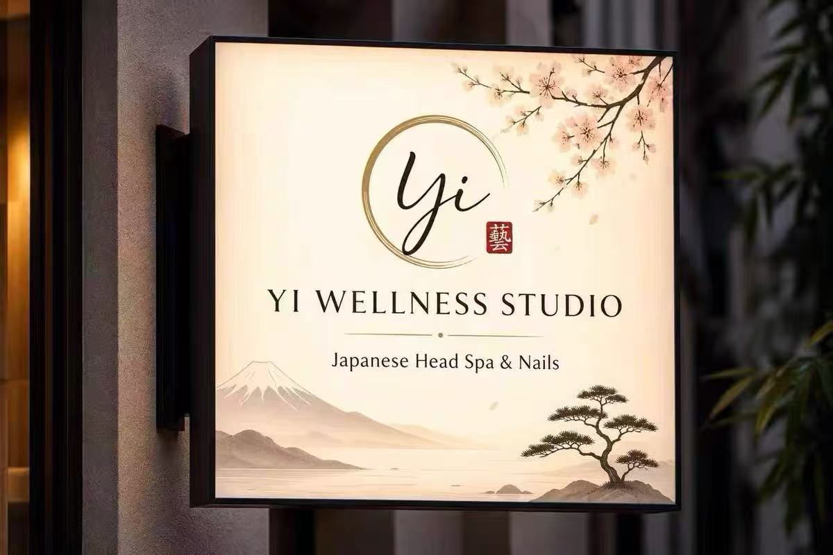 YI Wellness Studio illuminated sign, Japanese Head Spa and Nails, with Yi calligraphy, Mount Fuji and a pine tree